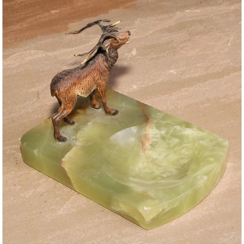 446 - An Austrian cold painted bronze, of a stag, mounted on a green onyx dish, 14cm long, c.1930