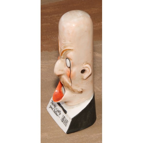 230 - A German porcelain novelty caricature spill holder, For He's a Jolly Good Fellow...', 13.5cm high, c... 