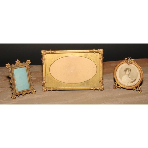 435 - An Art Nouveau turquoise mounted gilt metal easel photograph frame, 9cm high, c.1905; others (3)