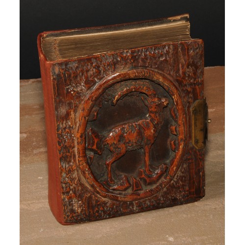 114 - A Black Forest novelty photograph or carte de visite album, the front pierced and carved with a stag... 