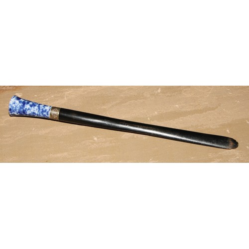 477 - An ebonised page turner, earthenware handle, 37.5cm long