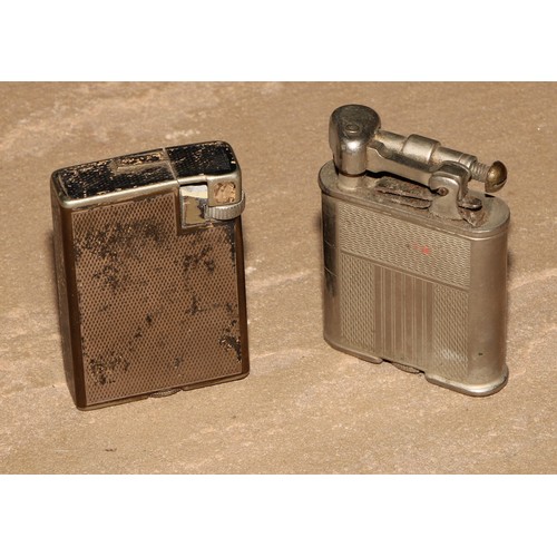 206 - A Dunhill silver plated rectangular lighter, engine turned, made in Switzerland, 5cm long; another, ... 