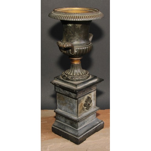 309 - A pair of 19th century dark patinated bronze half fluted campana mantel urns, beaded borders, wrappe... 