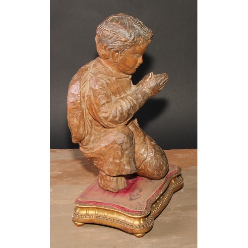 192 - A Continental carving, in the Baroque taste as a young figure kneeling in prayer, giltwood and gesso... 