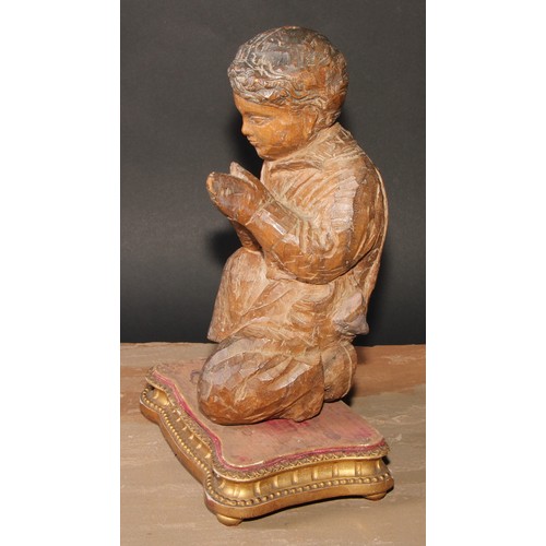 192 - A Continental carving, in the Baroque taste as a young figure kneeling in prayer, giltwood and gesso... 