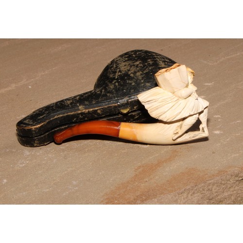 264 - A late 19th century meerschaum pipe, carved as a lady of wearing a flowing skirt, 8.5cm long, cased