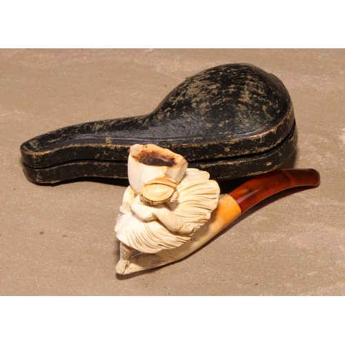 264 - A late 19th century meerschaum pipe, carved as a lady of wearing a flowing skirt, 8.5cm long, cased