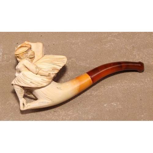 264 - A late 19th century meerschaum pipe, carved as a lady of wearing a flowing skirt, 8.5cm long, cased