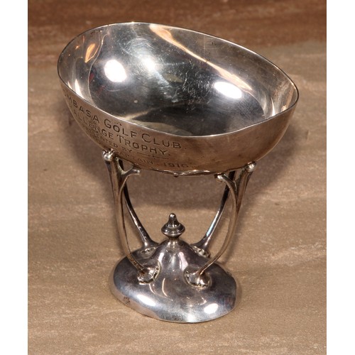 434 - An Art Nouveau silver presentation tazza, of Colonial African interest, the oval bowl inscribed Momb... 