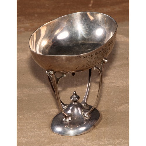 434 - An Art Nouveau silver presentation tazza, of Colonial African interest, the oval bowl inscribed Momb... 