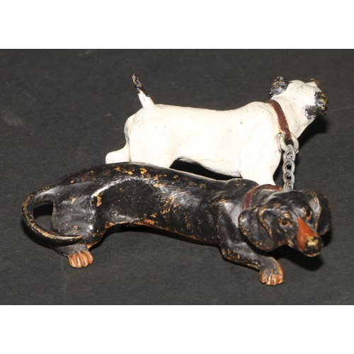 442 - An Austrian cold painted bronze group, cast as a dachshund and a terrier, 7cm long, indistinctly mar... 