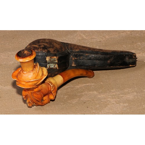 263 - A late 19th century meerschaum pipe, carved as a hand holding a rose, 11cm long, cased