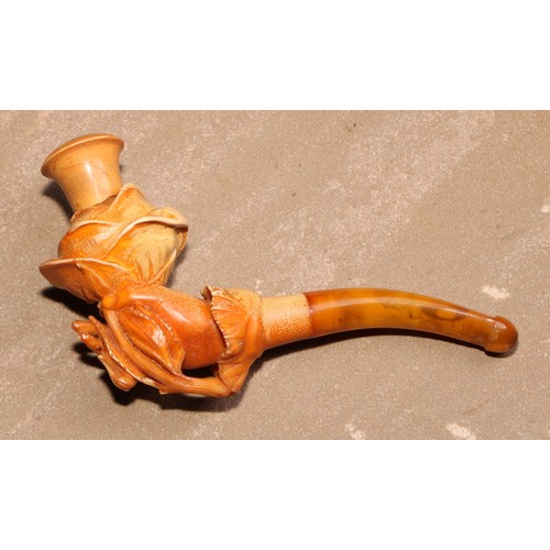 263 - A late 19th century meerschaum pipe, carved as a hand holding a rose, 11cm long, cased