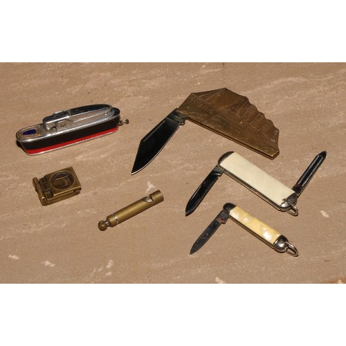 127 - A brass novelty penknife, as RMS Titanic, 7.5cm long; a cigarette lighter, as an ocean liner, 6.5cm ... 