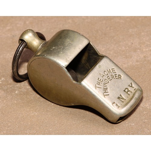 877 - A Hudson's patent whistle, The ACME Thunderer, stamped G.N.Ry [Great Northern Railway], 6cm long; an... 