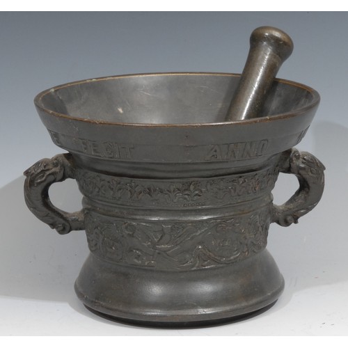 207 - A Dutch bronze pestle and mortar, cast with birds and scrolling foliage, inscribed beneath the rim H... 