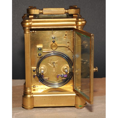 698 - A late 19th century French gilt brass repeater carriage clock, 5.5cm circular enamel inscribed with ... 