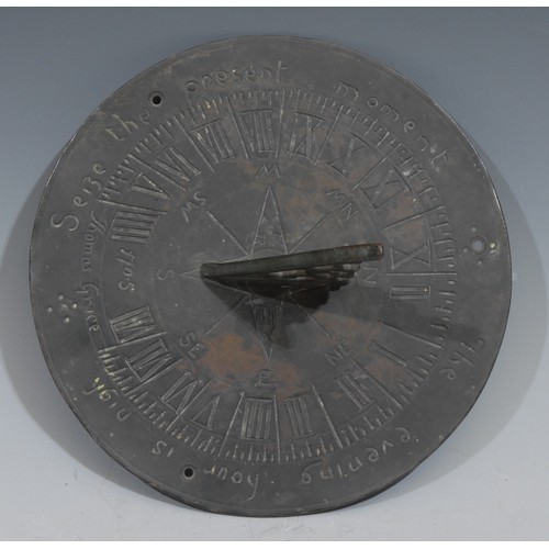 131 - A bronze sundial, shaped gnomon, Roman numerals, engraved Seize the Present Moment, The Evening Hour... 