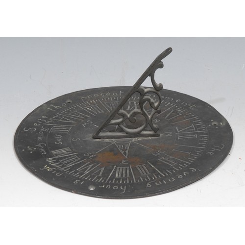 131 - A bronze sundial, shaped gnomon, Roman numerals, engraved Seize the Present Moment, The Evening Hour... 