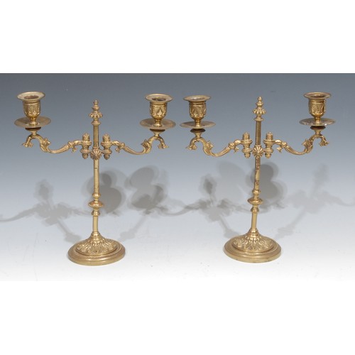 326 - A pair of early 20th century gilt brass adjustable rise-and-fall two-light candelabra, 31cm high, c.... 