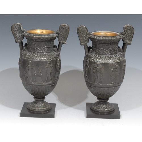 312 - A pair of 19th century Grand Tour bronze urns, after Ancient Greek volute kraters, cast in bas relie... 