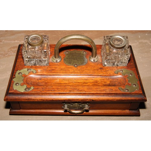 562 - Freemasonry & Friendly Society Interest - an Edwardian oak rectangular inkstand, arched carrying han... 