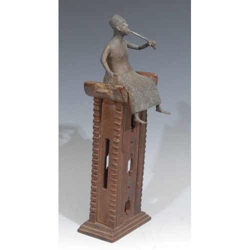 851 - Tribal Art - an Akan/Ashanti bronze and hardwood model, of a figure smoking a pipe, seated upon an o... 