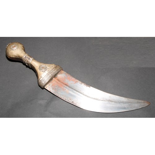 862 - A Middle Eastern Jambiya dagger, 18cm curved blade with central ridge, silver coloured metal mounted... 