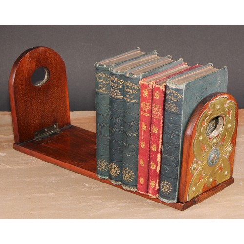 399 - A Victorian walnut bookslide, arched folding end supports, each applied with gilt brass cut-card wor... 