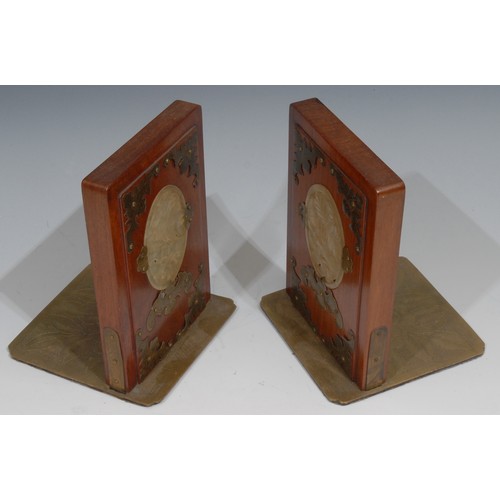 322 - A pair of Chinese jade mounted hardwood bookends, applied in brass cut-card work with bats, 16cm hig... 