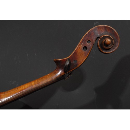 761 - A violin, the two-piece back 36cm long excluding button, 59.5cm long overall, the bow apparently uns... 