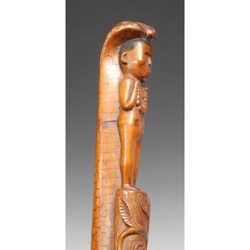 747 - An Indian walking stick, carved with a figure and a cobra, the entwined shaft with a meandering flow... 