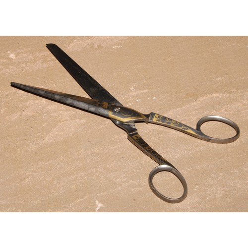 304 - A pair 19th century steel and gilt scissors, by M C Cronstedt, 17.5cm long, fitted case