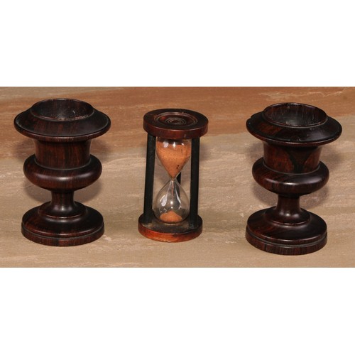 667 - Treen - a 19th century boxwood and ebonised egg timer, draught-turned ends, 8cm high; a pair of 19th... 