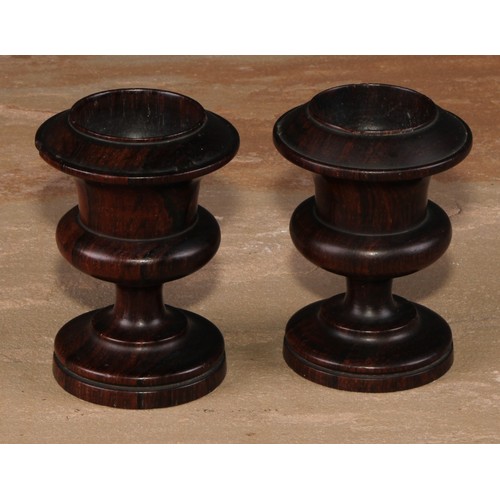 667 - Treen - a 19th century boxwood and ebonised egg timer, draught-turned ends, 8cm high; a pair of 19th... 