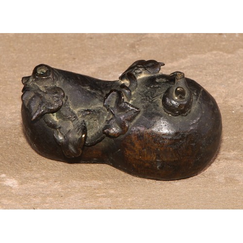 144 - A Chinese bronze water dropper, cast as a gourd shaped fruit surmounted by a snail, 6cm long