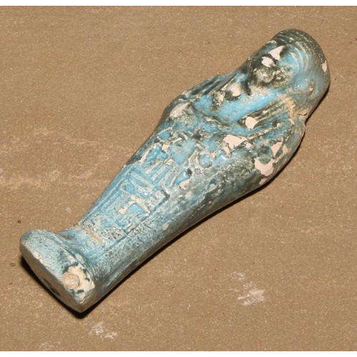 866 - Antiquities - an Egyptian shabti, 15cm long; another, turquoise glaze; another (3)