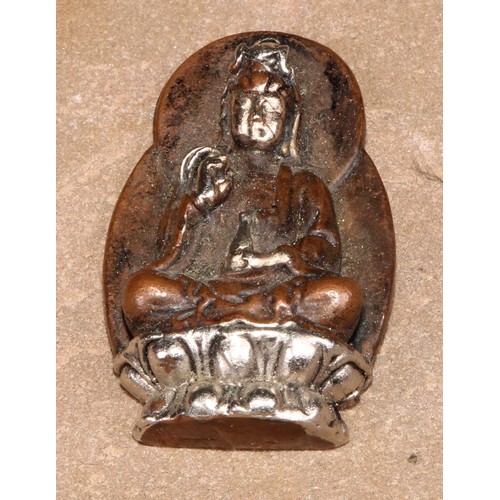 372 - A silvered, gilt and brown patinated Tibetan Buddhist amulet, as a miniature phurba, 6.5cm long; oth... 