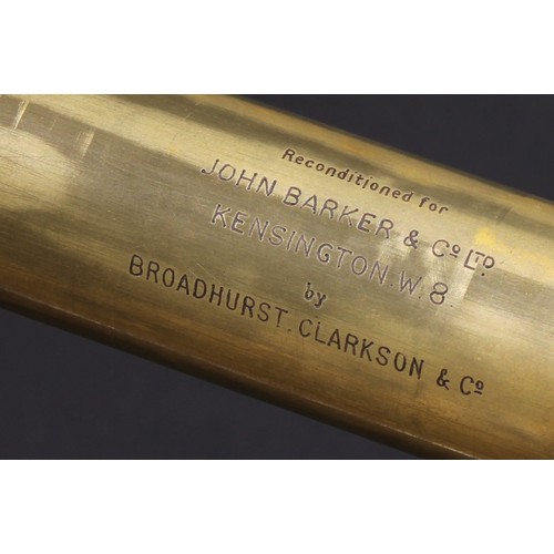 727 - An early 20th century brass three-draw telescope, inscribed Reconditioned for John Barker & Co Ltd, ... 