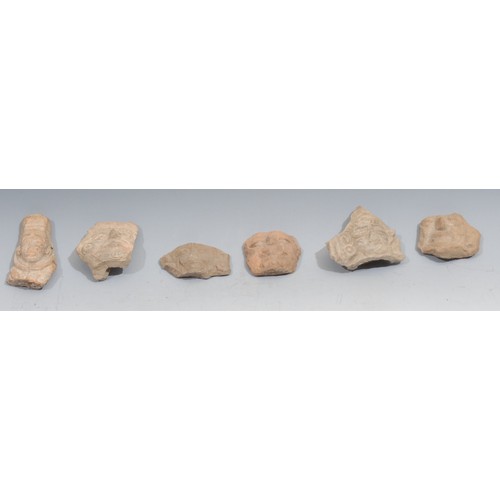 865 - A group of six pre Columbian terracotta mask fragments, probably Aztec or Toltec