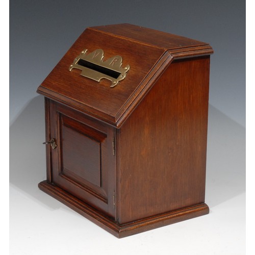 395 - A Victorian oak country house post box, sloping top with letter aperture, the brass mount pierced VR... 