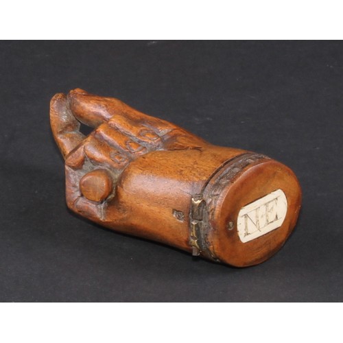 735 - A 19th century treen novelty snuff box, as a fist grasping a baton and gesturing a pinch, hinged cov... 