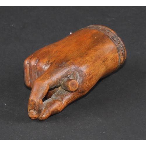 735 - A 19th century treen novelty snuff box, as a fist grasping a baton and gesturing a pinch, hinged cov... 