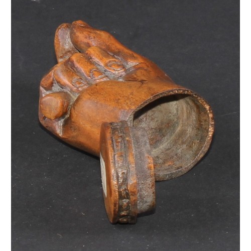 735 - A 19th century treen novelty snuff box, as a fist grasping a baton and gesturing a pinch, hinged cov... 