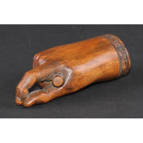 735 - A 19th century treen novelty snuff box, as a fist grasping a baton and gesturing a pinch, hinged cov... 