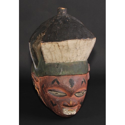 840 - Tribal Art - a Yoruba mask, painted in polychrome, 37cm long, Nigeria