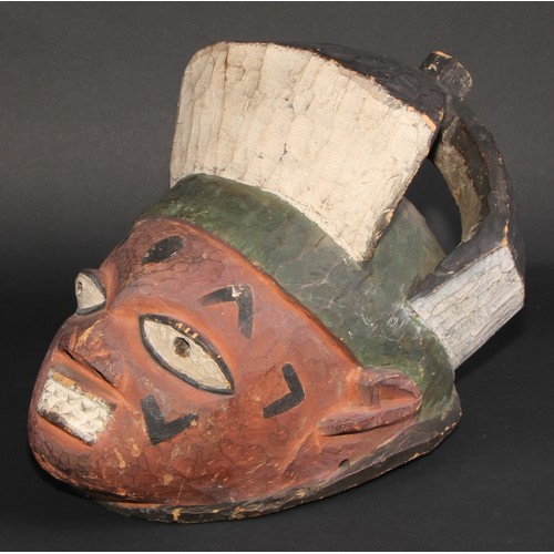 840 - Tribal Art - a Yoruba mask, painted in polychrome, 37cm long, Nigeria