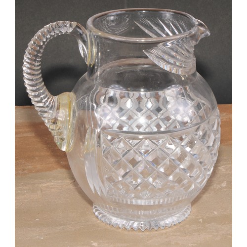 63 - A 19th century hobnail-cut glass ovoid jug, possibly Irish, scroll handle, star-cut base, 17.5cm hig... 