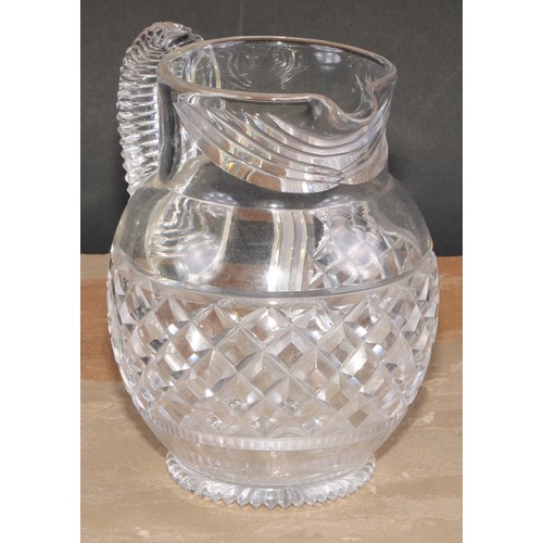 63 - A 19th century hobnail-cut glass ovoid jug, possibly Irish, scroll handle, star-cut base, 17.5cm hig... 