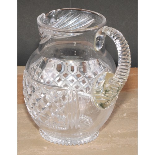 63 - A 19th century hobnail-cut glass ovoid jug, possibly Irish, scroll handle, star-cut base, 17.5cm hig... 